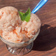 Guava Cream Cheese Sherbet in glass dish on wooden table